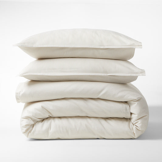 Khaki Stripe Cotton-Chambray Duvet Cover and two shams, stacked, with thin woven stripes.