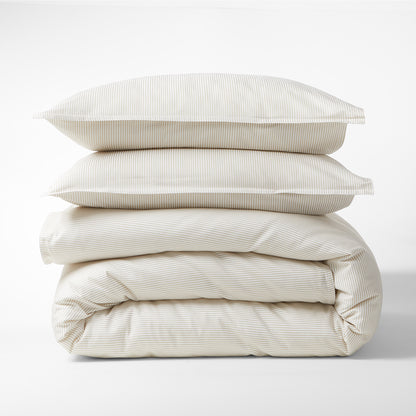 Stacked Khaki Stripe Cotton-Chambray Pillow Shams and duvet cover with thin stripes and 2" flange.