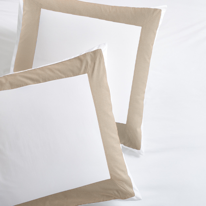 Set of two white percale pillow shams with a wide khaki appliqued border.