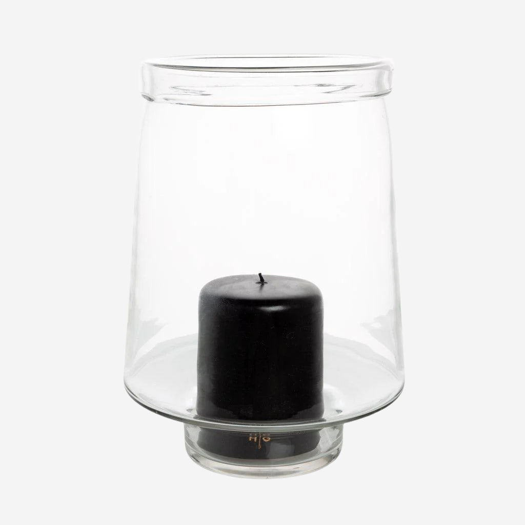 Large Antwerp clear glass hurricane candle holder with a black pillar candle inside.