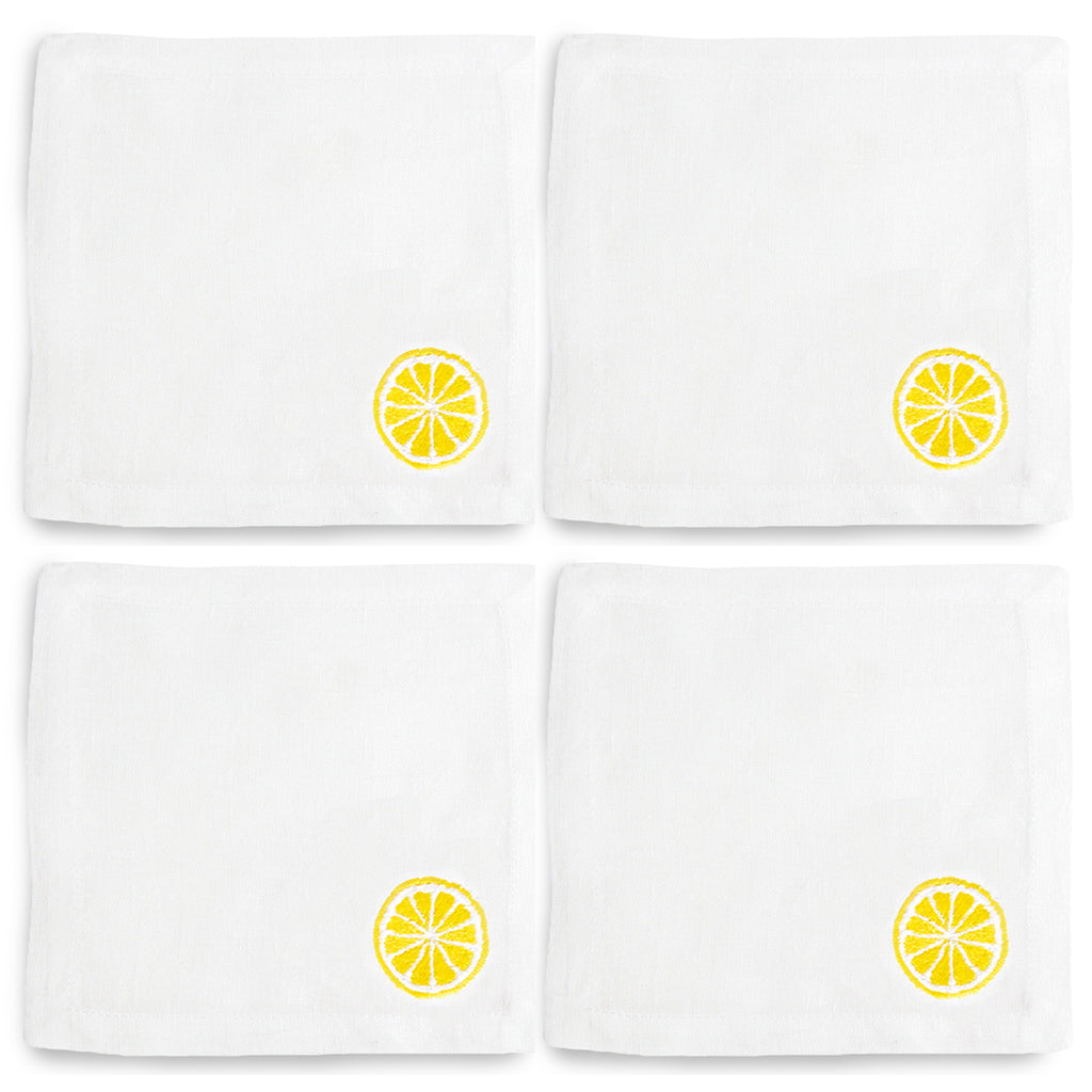 Set of 4 white linen cocktail napkins with embroidered yellow lemon slice design.