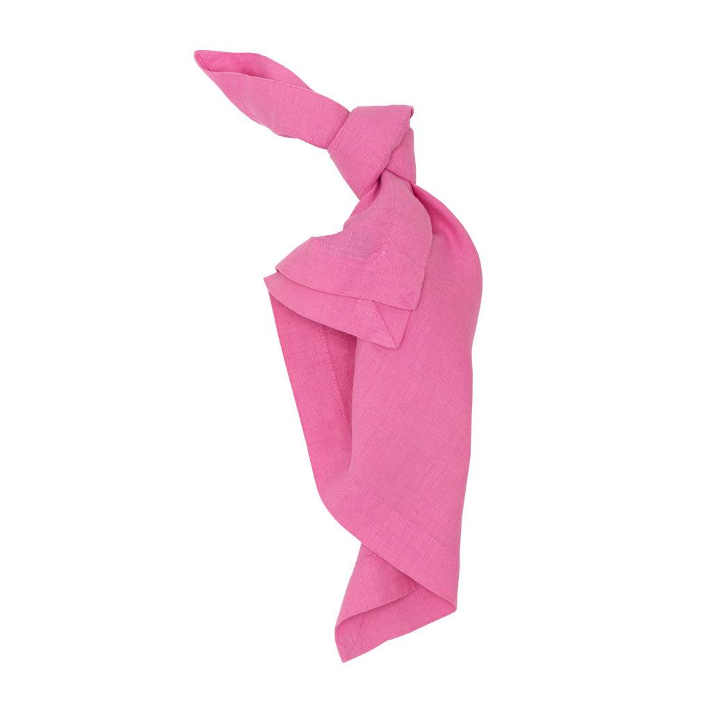 Lily HG Signature hand-dyed pink linen napkin, 22-inch square, tied in a knot.