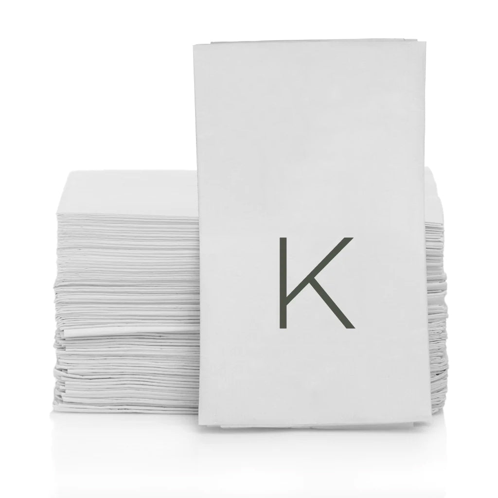 Stack of white 3-ply paper hand towels with a grey monogram letter K.