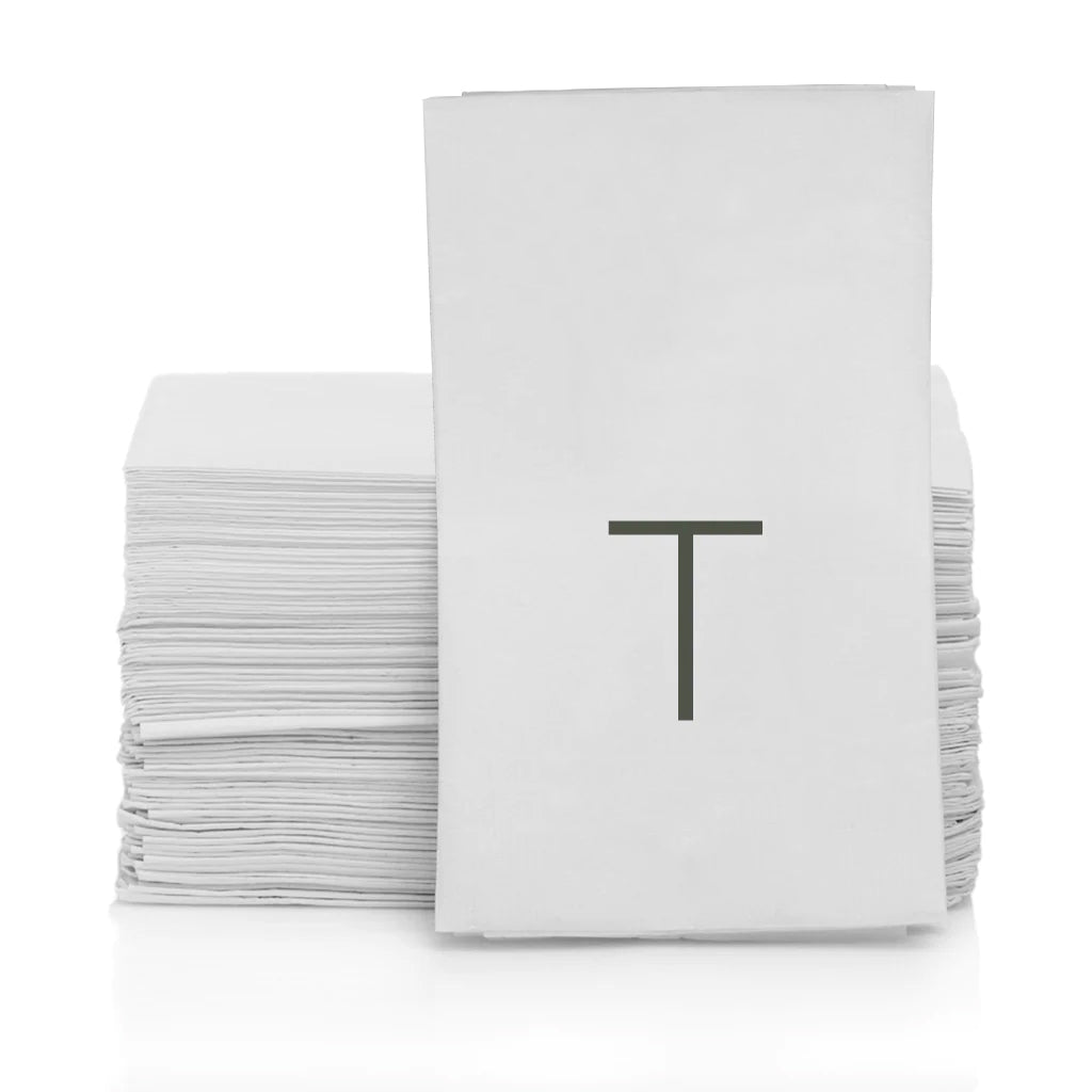 Stack of white 3-ply paper hand towels with a grey monogram letter "T".