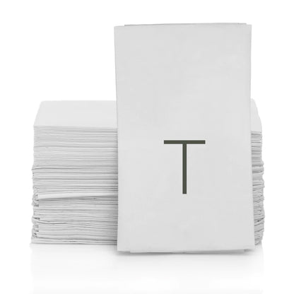 Stack of white 3-ply paper hand towels with a grey monogram letter "T".