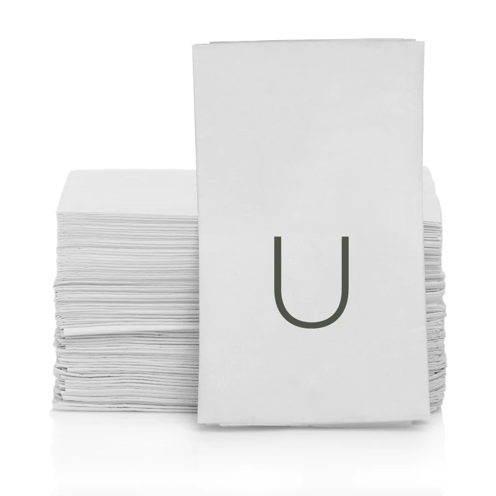 White 3-ply paper hand towels with a grey monogram letter "U" in a stack.