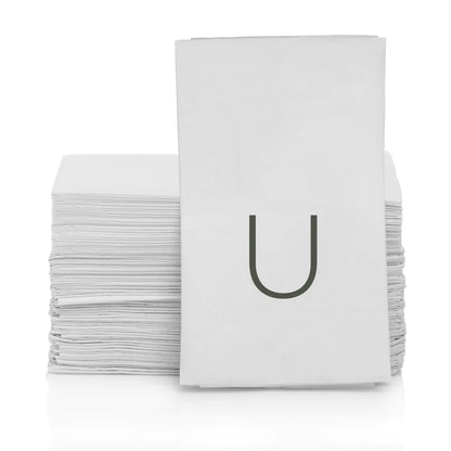 White 3-ply paper hand towels with a grey monogram letter "U" in a stack.