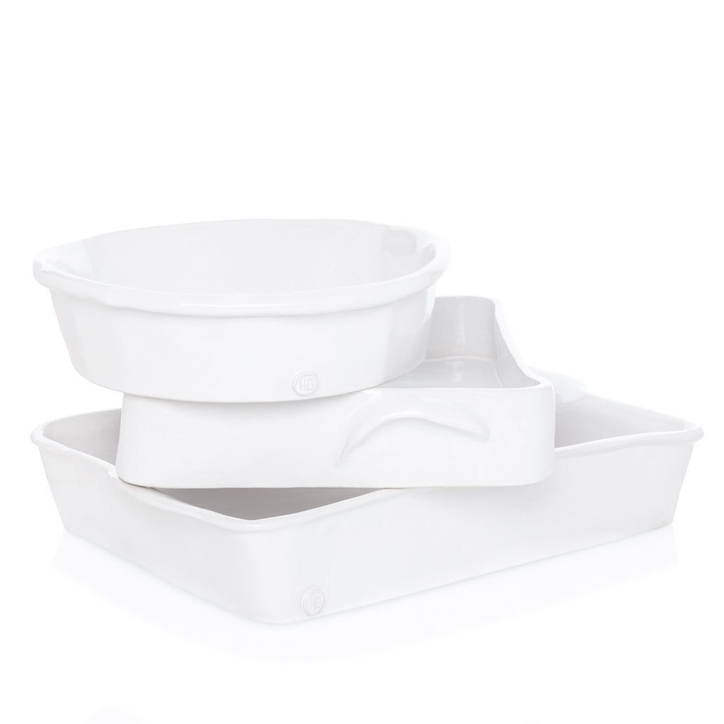 HG Montes Doggett handmade creamy white ceramic rectangular baking dish, stacked with two other bakeware pieces.