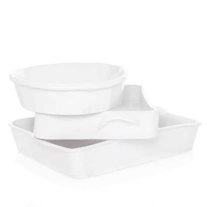 HG Montes Doggett handmade creamy white ceramic rectangular baking dish, stacked with two other bakeware pieces.