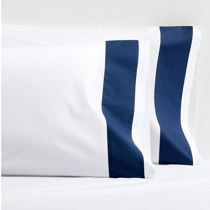 Set of 2 white percale pillowcases with a bold navy blue 4-inch wide band.