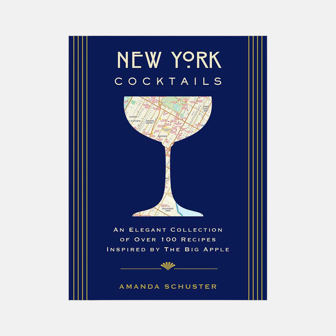 New York Cocktails book with a navy blue cover, gold stripes, and a map of NYC in a cocktail glass silhouette.