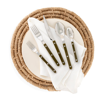 Olive green Bistro 5-piece flatware set with stainless steel and acrylic handles on a woven placemat.
