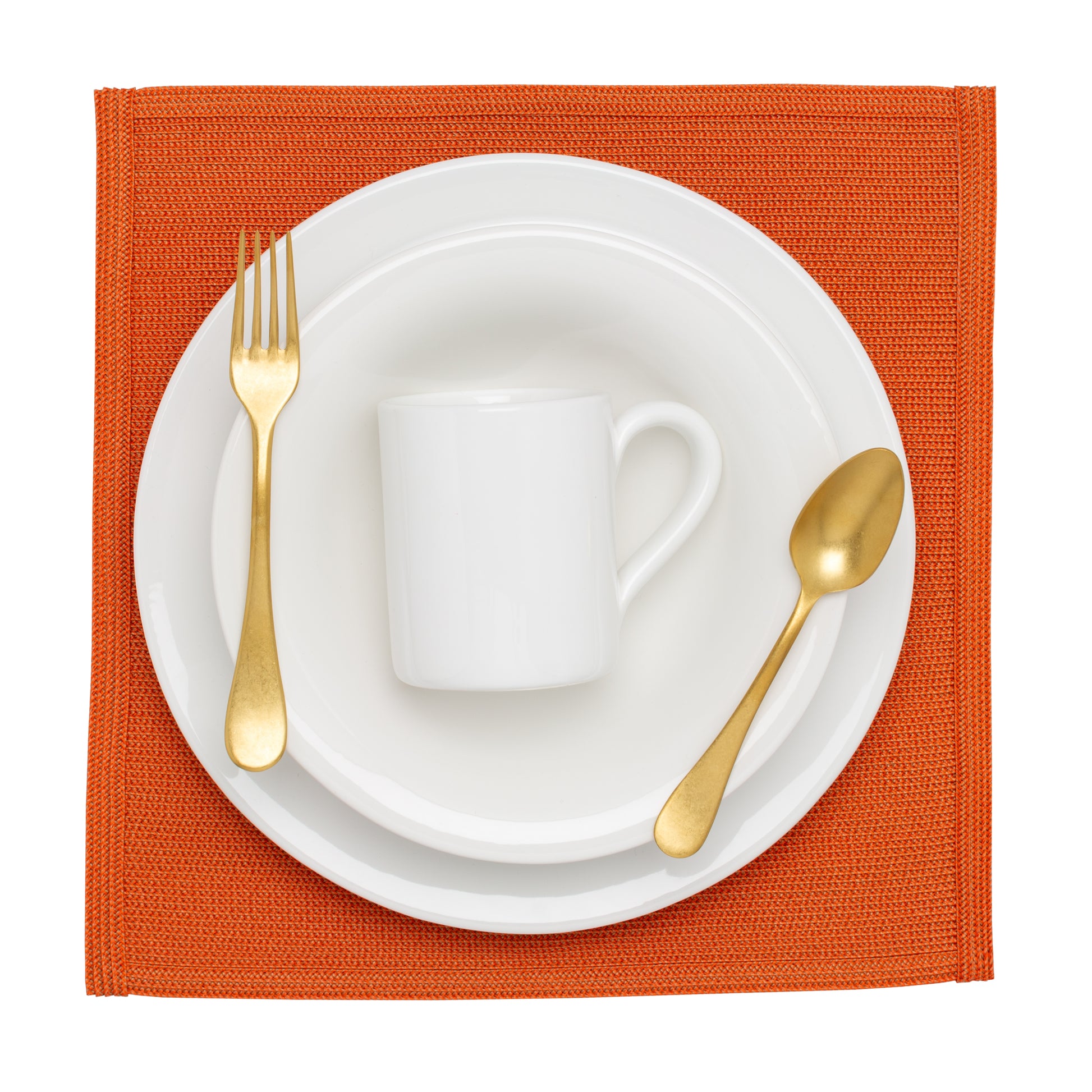 HG Original 10" creamy white ceramic salad plate, bowl, and mug set with gold flatware on an orange placemat.