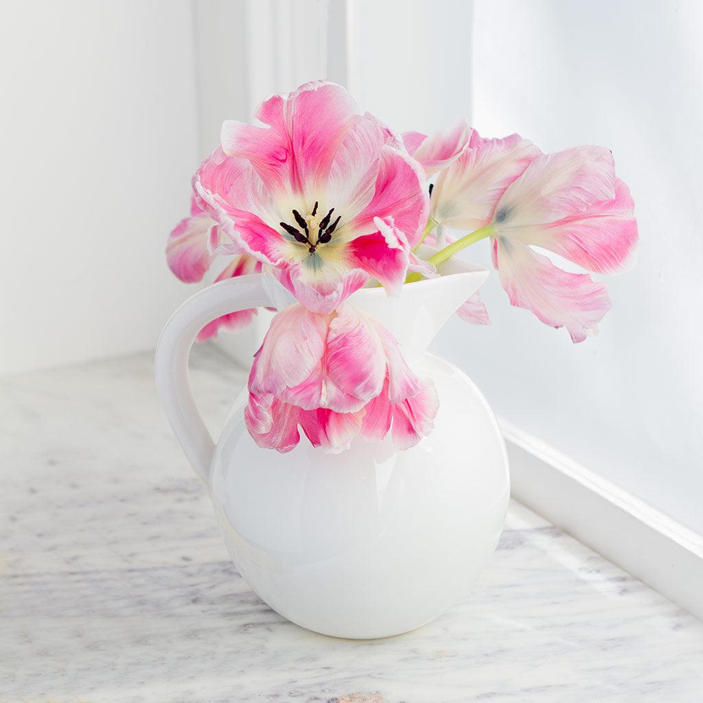 HG Original Large Round Ceramic Pitcher in creamy white, holding pink tulips.