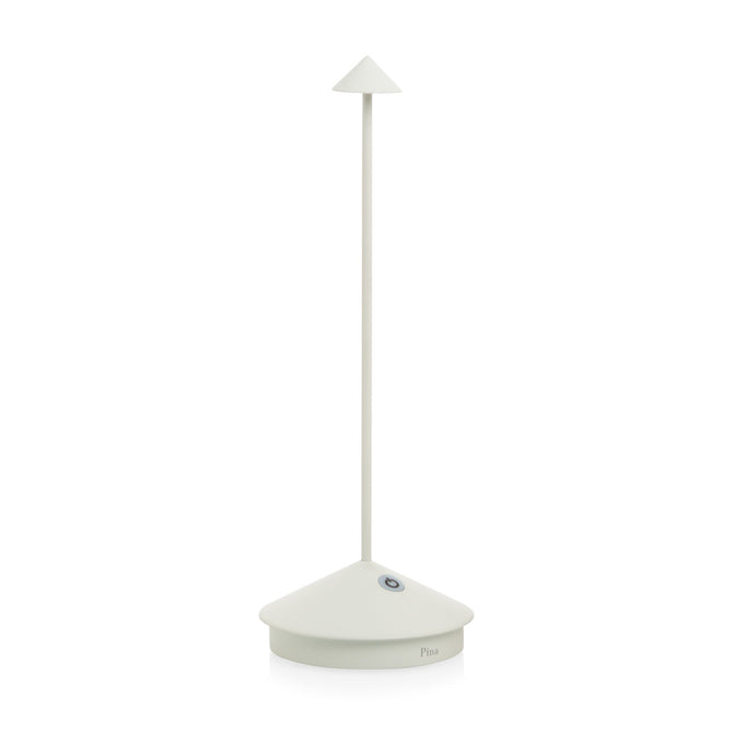 White die-cast aluminum Pina Pro rechargeable LED table lamp with a broad base and thin rod.