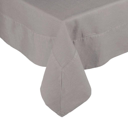 Rain HG Signature Hand-dyed Linen Tablecloth in a neutral grey, showing a mitered corner.