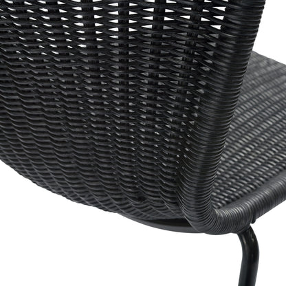 Black rattan "Wing" outdoor dining chair with woven polyethylene wicker seat and steel frame.