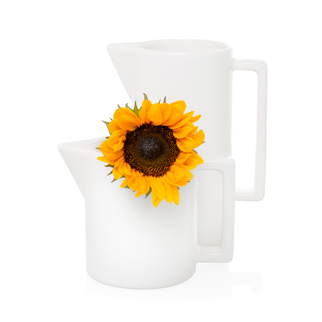 white ceramic pitcher with sunflower