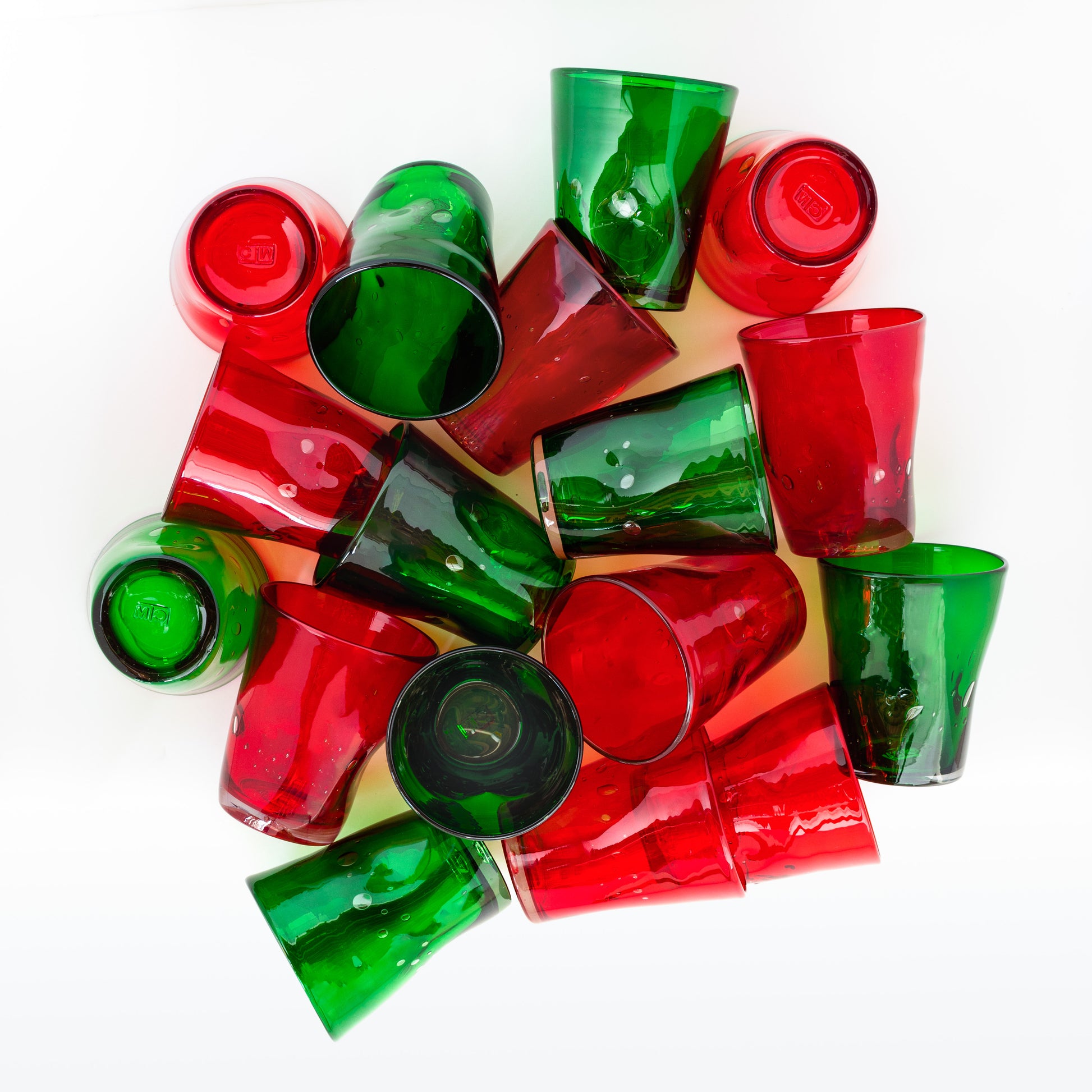 Pile of handmade red and green Henri mouth-blown glassware, 8 oz. glasses.