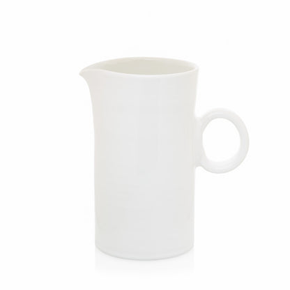 Creamy white ceramic pitcher with a simple ring handle and spout, 8"H.