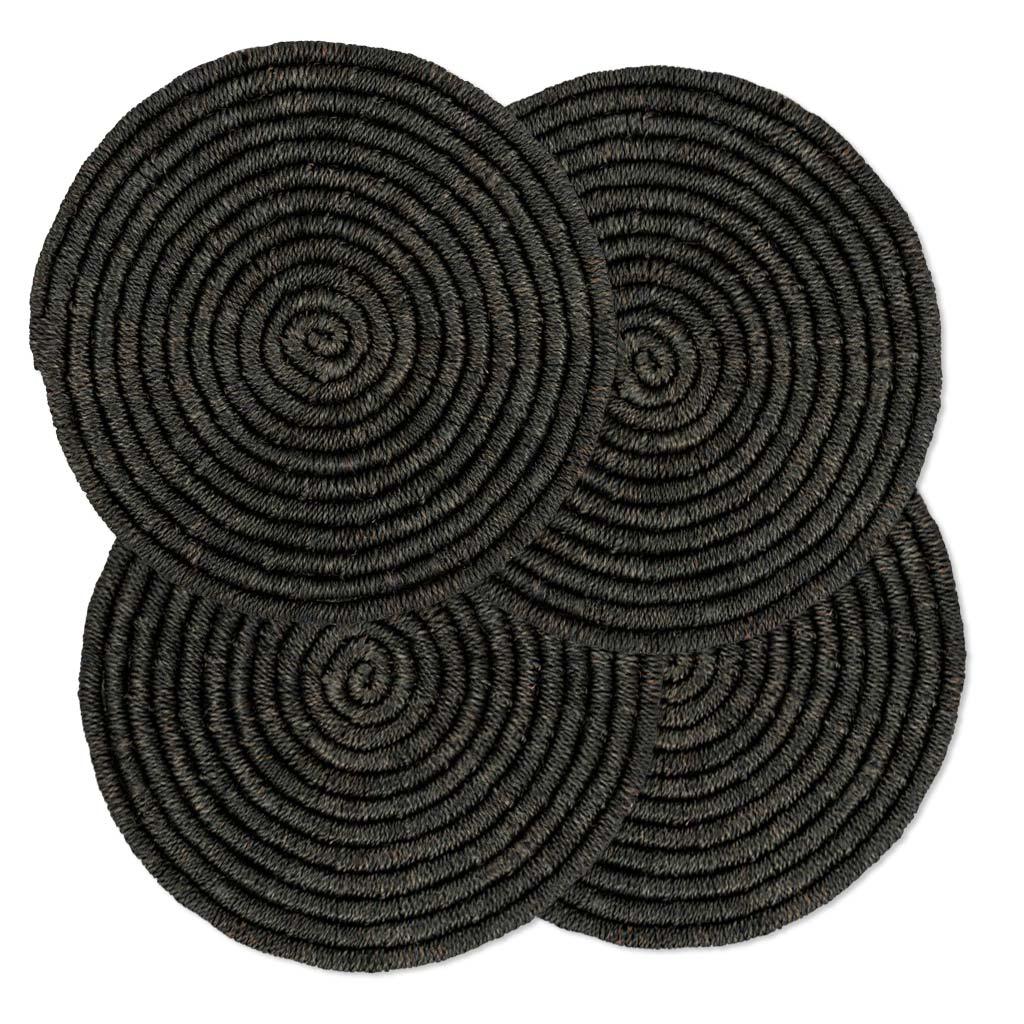 Four round black woven abaca placemats, 15" diameter, with a spiral texture.
