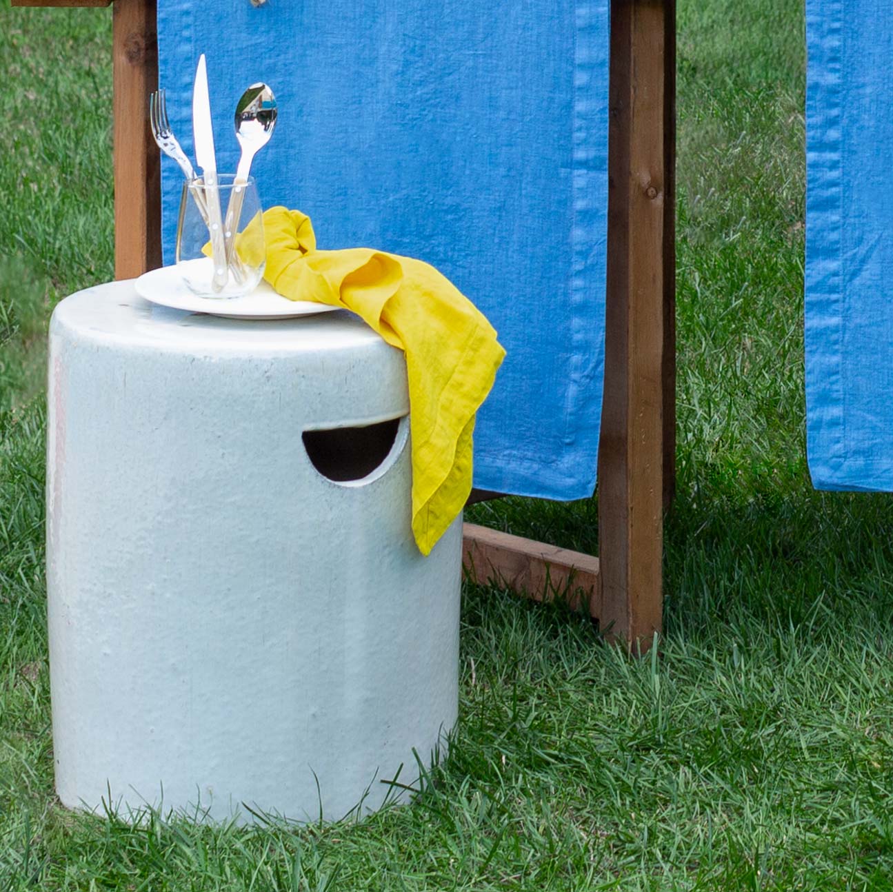 Rustic white ceramic cylinder garden stool with a unique handle cutout, 16.25"Dia x 20"H.