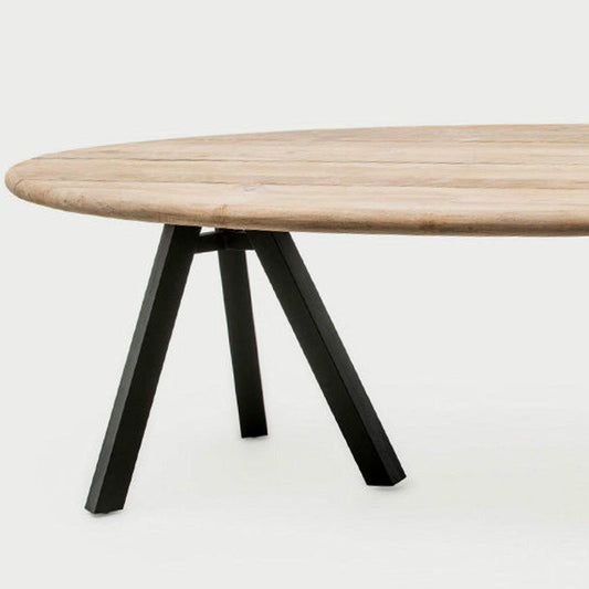 Samuel oval dining table with grey reclaimed teak wood top and matte black aluminum frame.