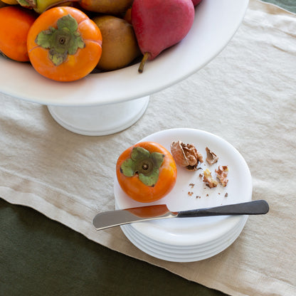 Stack of four white Hudson Grace earthenware appetizer plates with a low lip, 6.5" diameter.