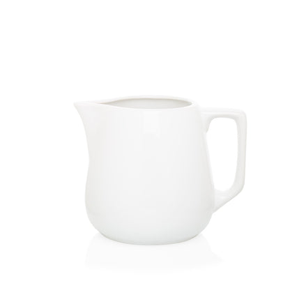 Small white ceramic milk pitcher with handle and spout, 5.5"H x 6.5"W.