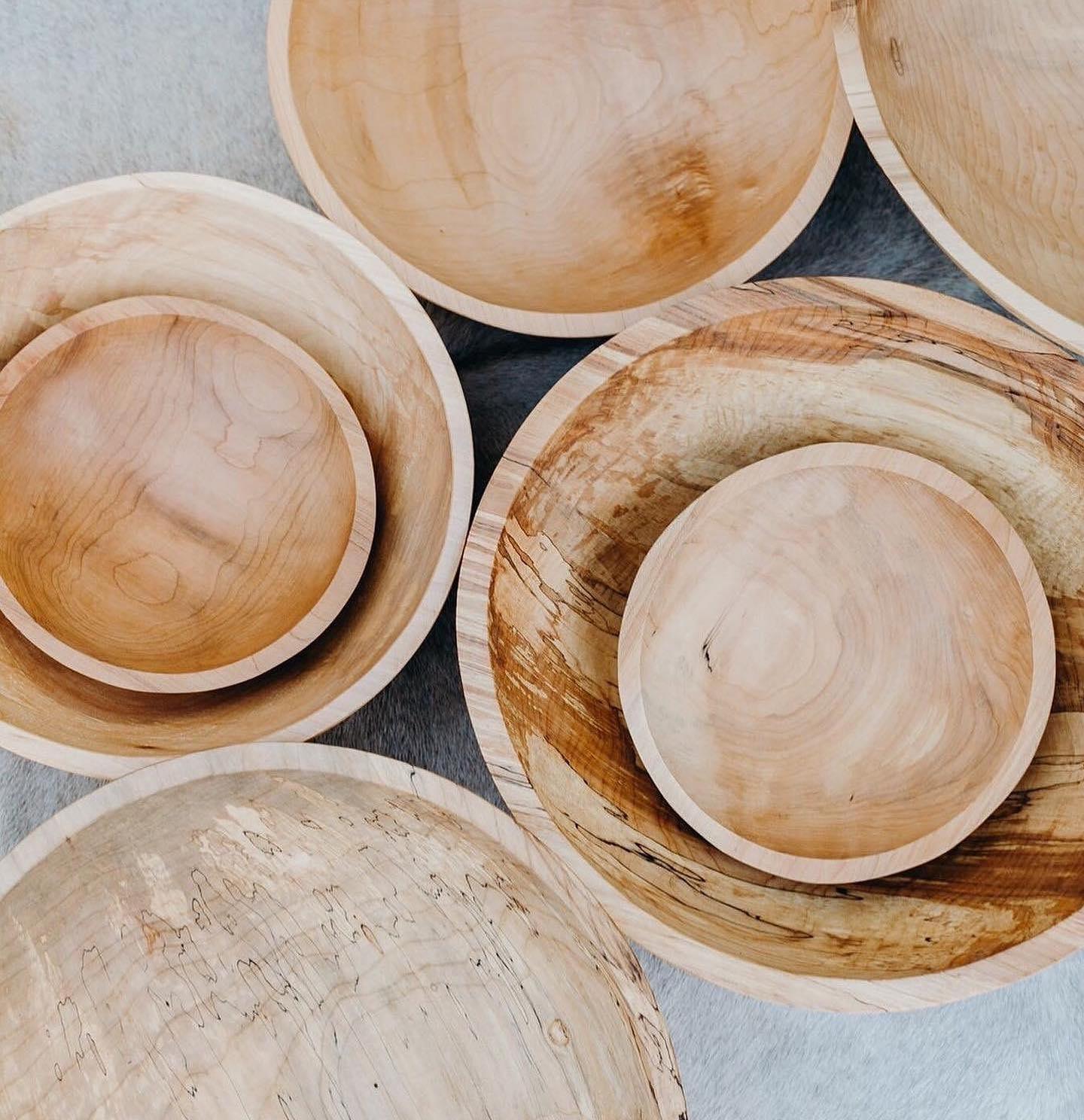 Collection of natural spalted maple wood bowls, varying in size and unique grain patterns.