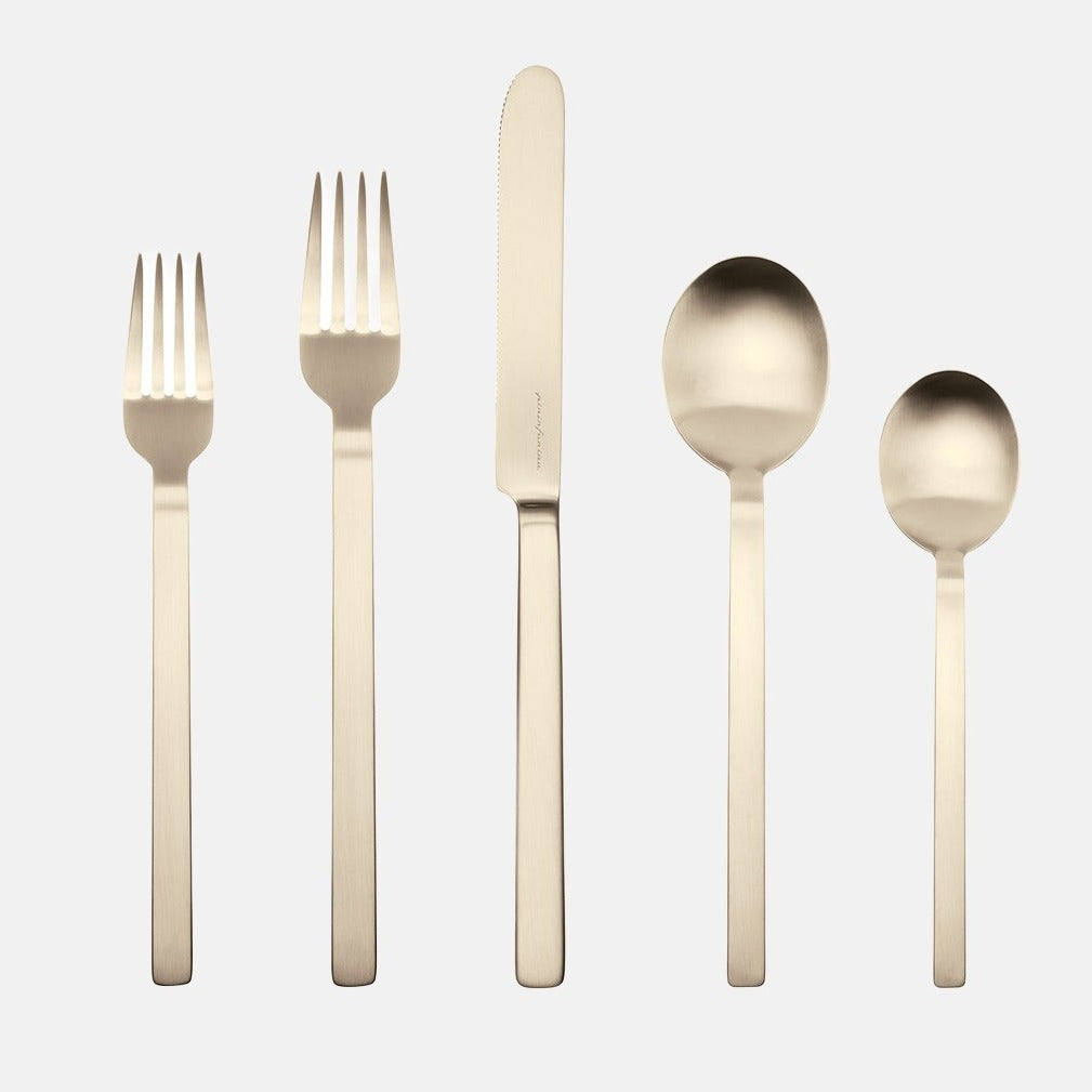 Stile Ice Champagne 5-piece flatware set: 18/10 stainless steel with a mirror-polished champagne finish.