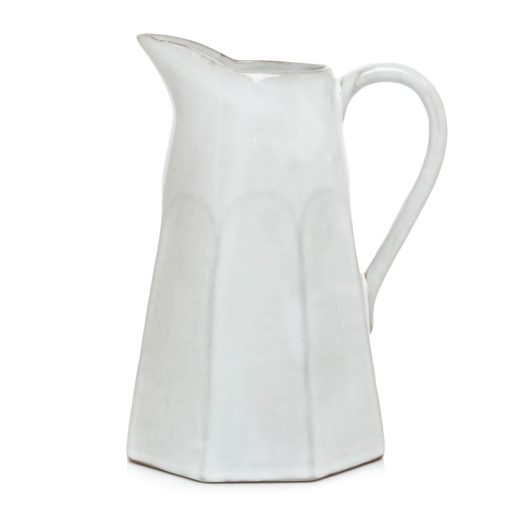 Stone grey terracotta pitcher, hand-glazed, with a faceted design and handle.
