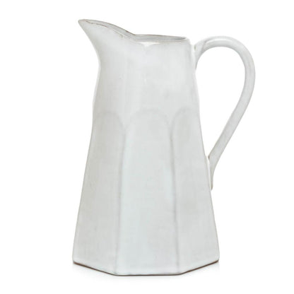 Stone grey terracotta pitcher, hand-glazed, with a faceted design and handle.