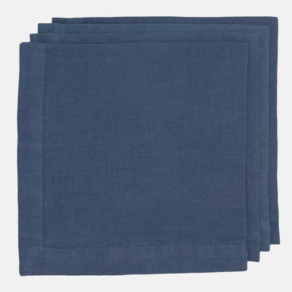 Stack of three Surf Blue HG Signature hand-dyed 22-inch linen napkins with mitered corners.
