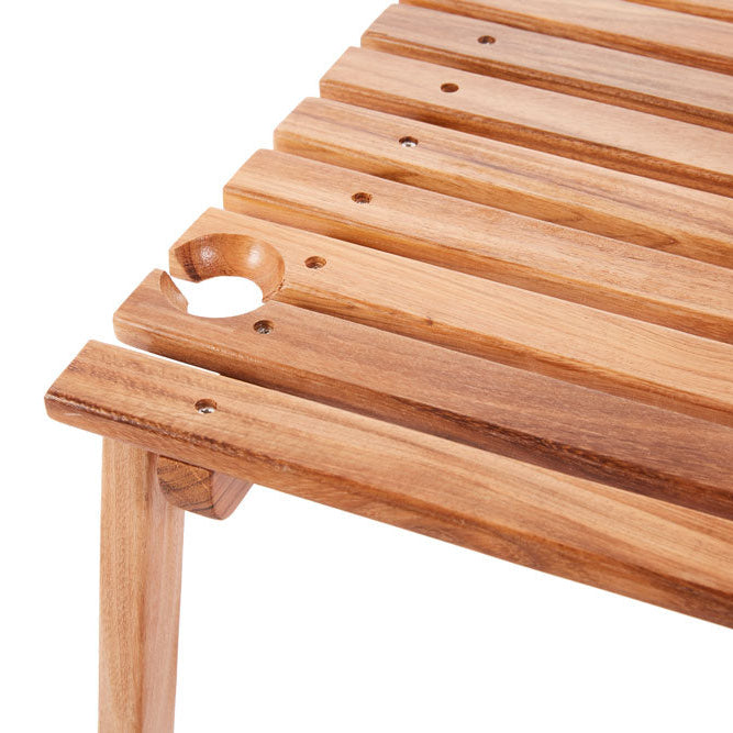 Teak portable outdoor picnic table with slatted top, wine glass holders, and folding legs.