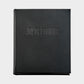 Black leather "Joy of Cooking" cookbook with blind embossed title.