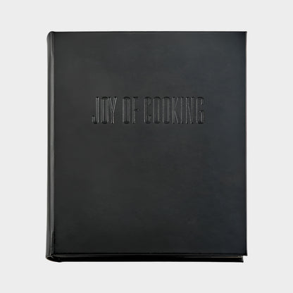 Black leather "Joy of Cooking" cookbook with blind embossed title.