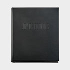 Black leather "Joy of Cooking" cookbook with blind embossed title.