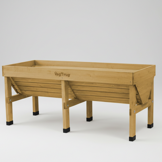 VegTrug Medium Wood Planter, a light brown cedarwood raised garden bed with a V-shape design.
