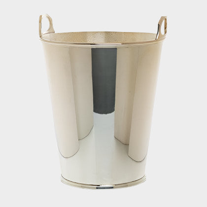 Vintage silverplate ice bucket with two small handles, shiny metallic finish.