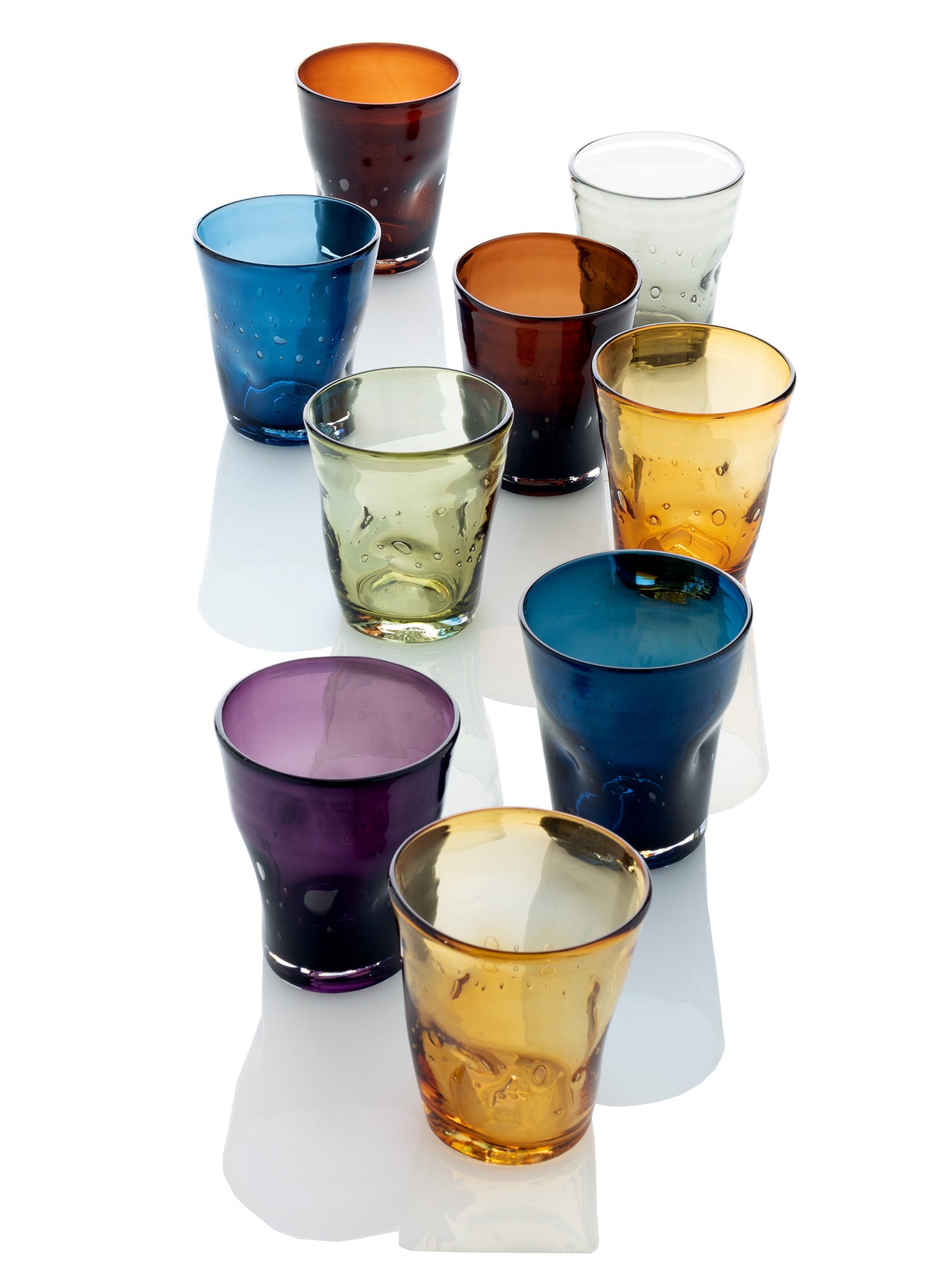 Collection of 9 handmade Henri mouth-blown glasses in various colors: violet, blue, amber, brown, clear, and green.