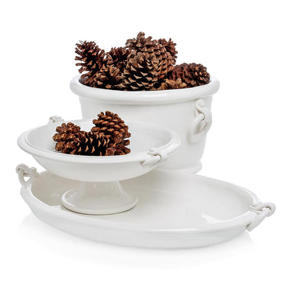 White ceramic oval ice bucket with ring handles, shown with matching pedestal bowl and tray.