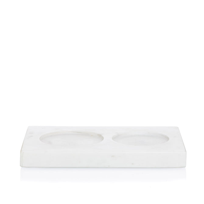 White marble dish soap and lotion tray with two circular indentations.