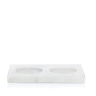 White marble hand soap and lotion tray with two honed circular indentations.