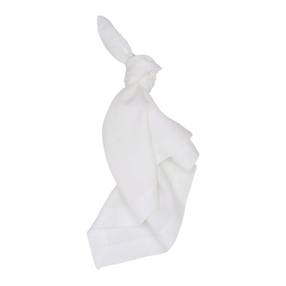 White HG Signature hand-dyed 22" square linen napkin, tied in a knot.