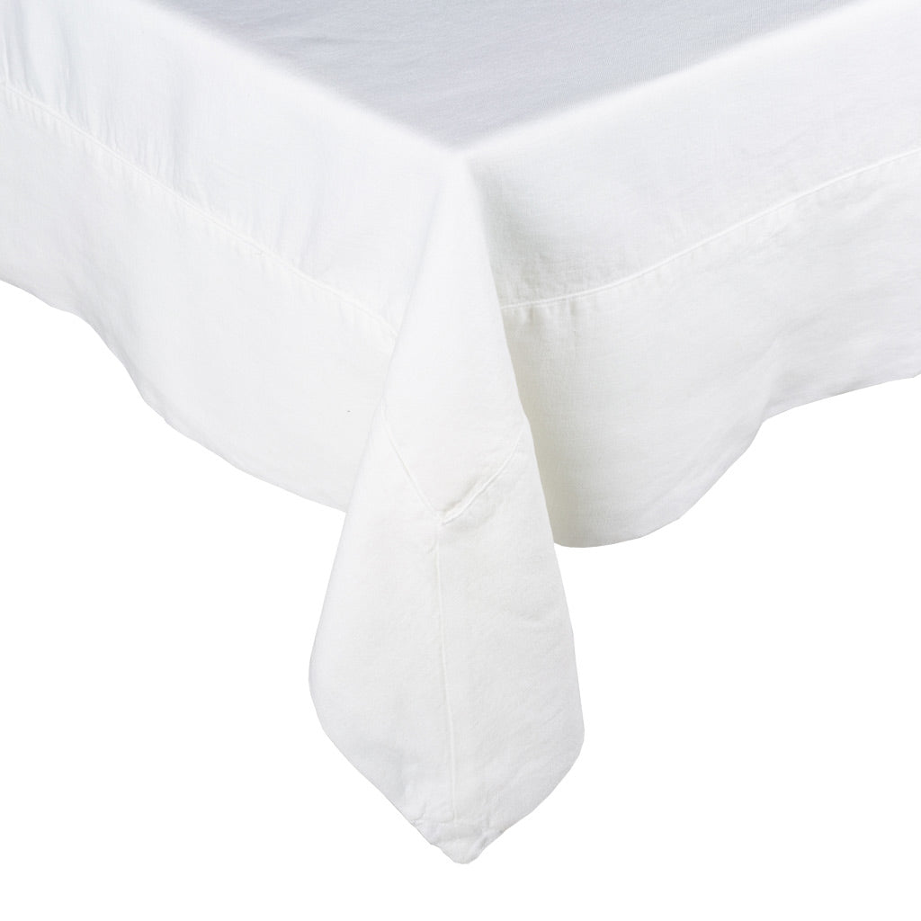 White HG Signature Hand-dyed Linen Tablecloth with generous border and mitered corner detailing.