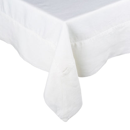 White HG Signature Hand-dyed Linen Tablecloth with generous border and mitered corner detailing.